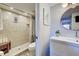 Clean bathroom with a walk-in shower, toilet and updated vanity at 1174 Bird Bay Way # 107, Venice, FL 34285