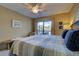 Main bedroom with king-size bed, offering comfort and relaxation at 1174 Bird Bay Way # 107, Venice, FL 34285