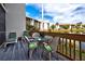 Relaxing deck with lake views, comfortable seating, and a dining area at 1174 Bird Bay Way # 107, Venice, FL 34285