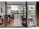 Enclosed patio with seating area and view of water feature at 1174 Bird Bay Way # 107, Venice, FL 34285