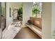 Covered walkway with bench and access to condo at 1174 Bird Bay Way # 107, Venice, FL 34285