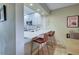Kitchen with breakfast bar and quartz countertops at 1174 Bird Bay Way # 107, Venice, FL 34285