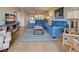 Living room features comfortable seating and a large TV at 1174 Bird Bay Way # 107, Venice, FL 34285