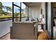 Cozy screened patio furnished with wicker seating, perfect for relaxing at 1174 Bird Bay Way # 107, Venice, FL 34285