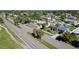 Aerial view of residential neighborhood with lush landscaping and homes at 126 Venice East Blvd, Venice, FL 34293