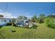 Landscaped backyard with a pool and patio at 126 Venice East Blvd, Venice, FL 34293