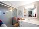 Clean bathroom with a walk-in shower and white vanity at 126 Venice East Blvd, Venice, FL 34293