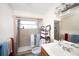 Bathroom with walk-in shower and updated vanity at 126 Venice East Blvd, Venice, FL 34293