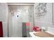Bathroom with a walk-in shower and storage at 126 Venice East Blvd, Venice, FL 34293