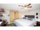 Bedroom with king-size bed and ceiling fan at 126 Venice East Blvd, Venice, FL 34293