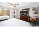 Bedroom with king-size bed and built-in desk at 126 Venice East Blvd, Venice, FL 34293