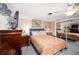 Bedroom with king-size bed and mirrored closet at 126 Venice East Blvd, Venice, FL 34293