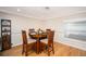 Cozy dining room with wood table and chairs, hardwood floors at 126 Venice East Blvd, Venice, FL 34293