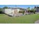 Ranch-style home with rock exterior and mature landscaping at 126 Venice East Blvd, Venice, FL 34293