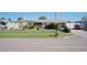 Ranch-style home with rock exterior and mature landscaping at 126 Venice East Blvd, Venice, FL 34293