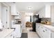 Clean and bright kitchen with white cabinets and modern appliances at 126 Venice East Blvd, Venice, FL 34293