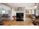 Open living area with hardwood floors, dining area and breakfast bar at 126 Venice East Blvd, Venice, FL 34293