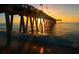 Sunset view from under a pier at 126 Venice East Blvd, Venice, FL 34293
