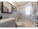 Clean bathroom with a shower/tub combo, vanity, and modern fixtures at 129 Gulf Ave, Nokomis, FL 34275