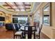 Bright dining area with hardwood floors and large windows at 135 Tina Island Dr, Osprey, FL 34229