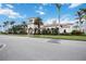 Community clubhouse with Spanish-style architecture and palm trees at 13912 Rinuccio St, Venice, FL 34293