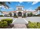 Community clubhouse with festive holiday decor and landscaping at 13912 Rinuccio St, Venice, FL 34293