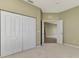 Spacious bedroom with double door closets and neutral color walls at 1599 Monarch Dr # 1599, Venice, FL 34293