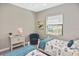 Cozy bedroom with two beds, soft carpeting and a bright window with backyard views at 169 N Cayman Isles Blvd, Englewood, FL 34223