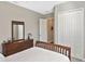 Bedroom with a queen bed and dresser at 169 N Cayman Isles Blvd, Englewood, FL 34223