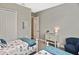 Comfortable bedroom with two twin beds, closet and neutral wall color at 169 N Cayman Isles Blvd, Englewood, FL 34223