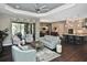 Open-concept layout connecting living, dining, and kitchen areas, creating a spacious and inviting environment at 169 N Cayman Isles Blvd, Englewood, FL 34223