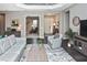 Bright and airy living room featuring modern furniture, hardwood floors, and a welcoming atmosphere at 169 N Cayman Isles Blvd, Englewood, FL 34223