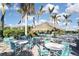 Tropical pool area with thatch-roofed bar and seating at 169 N Cayman Isles Blvd, Englewood, FL 34223