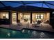 Stunning pool and patio area with lounge chairs, perfect for relaxing evenings at 169 N Cayman Isles Blvd, Englewood, FL 34223