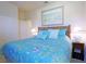 King-size bedroom with coastal decor and en-suite bathroom at 20230 Granlago Dr, Venice, FL 34293