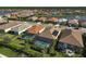 Aerial view of homes with pools and a lake at 20329 Concerto Pl, Venice, FL 34293