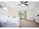 Comfortable main bedroom with sliding door access to the backyard at 229 Venice Palms Blvd, Venice, FL 34292