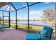 Relaxing screened patio overlooking a serene lake at 24029 Canterwood Way, Venice, FL 34293