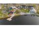 Aerial view of lakefront community with shops and green spaces at 25151 Spartina Dr, Venice, FL 34293