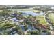 Aerial view of community clubhouse, golf course and lake at 25151 Spartina Dr, Venice, FL 34293