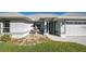 House entrance with a white door and decorative fountain at 30 Princeton Rd, Venice, FL 34293