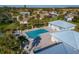 Community pool and spa with surrounding patio and lounge area at 3015 Seawind Cir # 12A, Venice, FL 34293