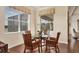 Cozy breakfast nook with wicker chairs and a glass-top table at 310 Marsh Creek Rd, Venice, FL 34292