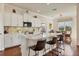 Modern kitchen with white cabinets, quartz countertops, and a large island with seating at 310 Marsh Creek Rd, Venice, FL 34292