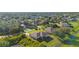 Aerial view of a residential neighborhood showcasing various houses and lush greenery at 4467 Cinderella Cir, North Port, FL 34286