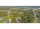 An aerial view showing a neighborhood's layout, featuring houses and roads at 4467 Cinderella Cir, North Port, FL 34286
