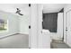 Clean bathroom with dark grey tile and white vanity at 4467 Cinderella Cir, North Port, FL 34286