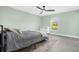 Bedroom with green walls, ceiling fan, and a double bed at 4467 Cinderella Cir, North Port, FL 34286