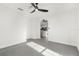 Spacious bedroom with grey tile floors, ceiling fan, and view of living area at 4467 Cinderella Cir, North Port, FL 34286