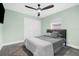 Bedroom with soft green walls, ceiling fan, and a double bed at 4467 Cinderella Cir, North Port, FL 34286